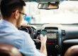Man texting o phone while driving
