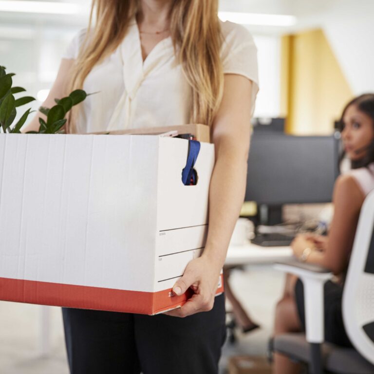 fired Employee carrying her thinks back home after getting fired