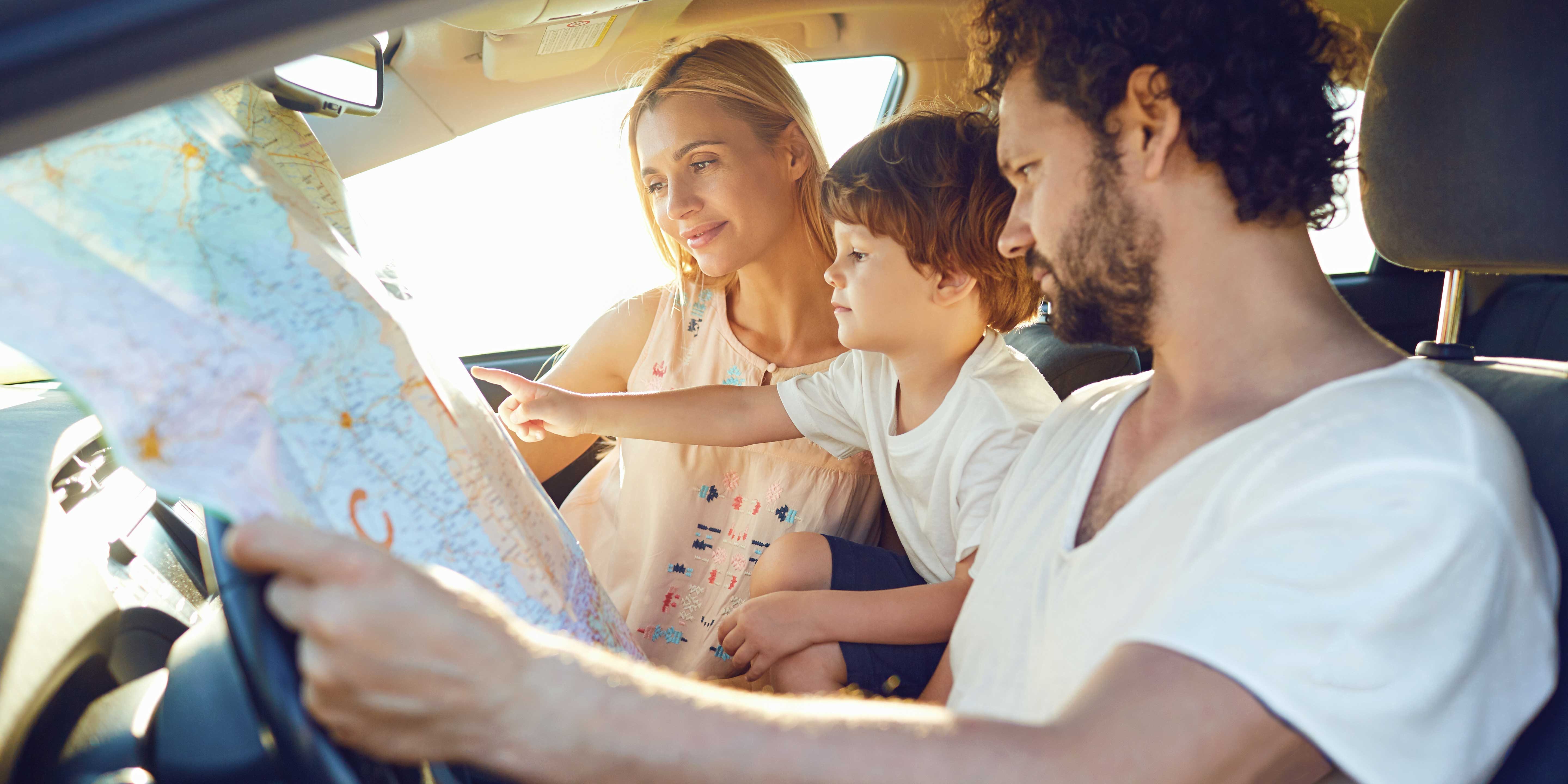 Family looking at the map in the car