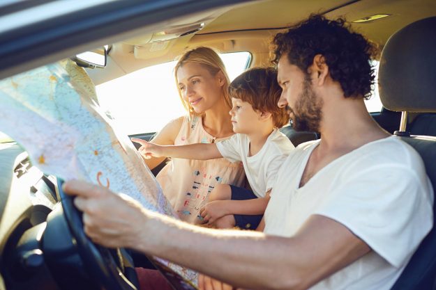 Family looking at the map in the car