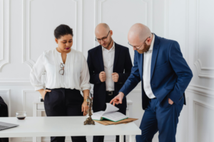 Couple meets with personal injuty lawyer in office.