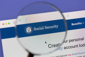 Magnifying glass showing social security website.
