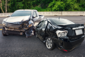 Two cars crashed in the middle of the road.