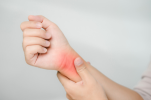 Person with pain on their wrist.