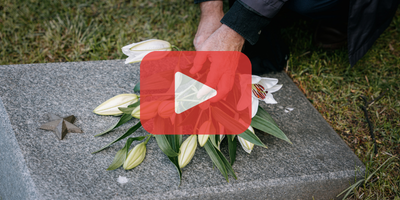 Person putting flowers on grave. Red play button overlay and SEC logo.