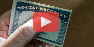 SS card Person holding social security card. Red play buttom overlay and SEC logo.