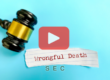 Judges gavel and scrap of paper with words: Wrongful death and SEC logo.
