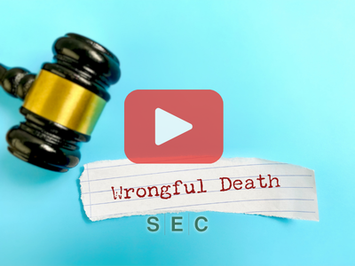 Judges gavel and scrap of paper with words: Wrongful death and SEC logo.
